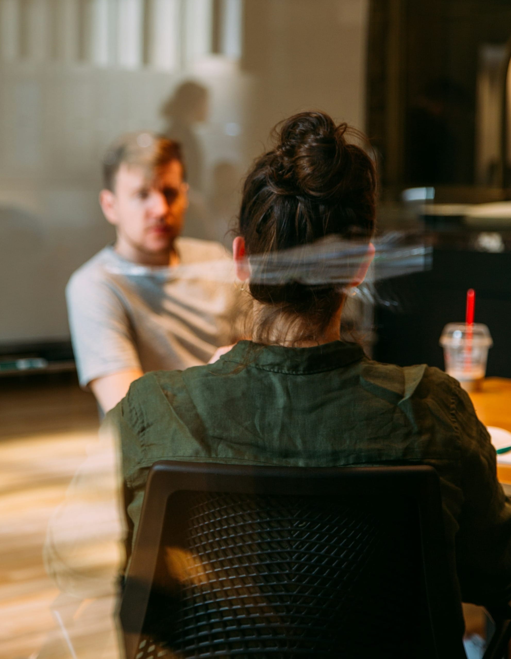 person sitting in a chair in front of a man